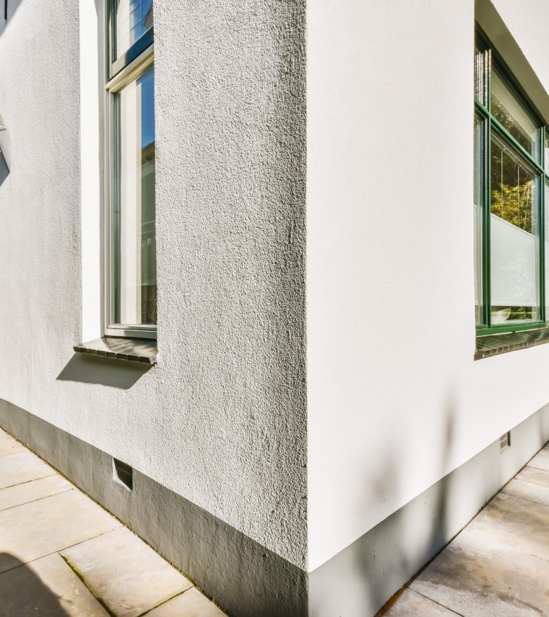 Outside corner of the house with two windows